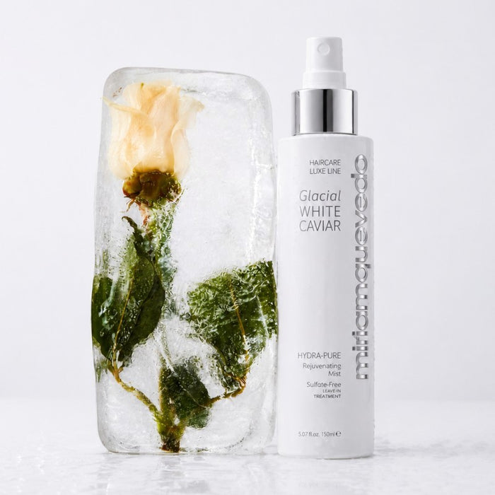 Shop Rescue Spa miriam quevedo Glacial White Caviar Hydra-Pure Rejuvenating Mist bottle next to a rose frozen in ice.