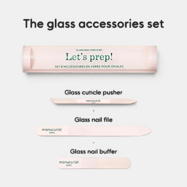 Manucurist “Let’s prep!” glass accessories set shown with case and three tools: glass nail file, glass cuticle pusher, and glass nail buffer arranged on a light background.