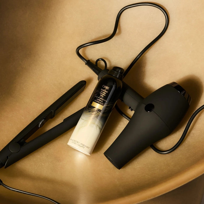 Shop Rescue Spa Gold Lust Dry Heat Protection Spray with flat iron and hairdryer, protects hair from heat.