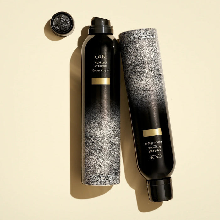 Shop Rescue Spa Oribe Gold Lust Dry Shampoo bottles in black and grey packaging with gold accents on a cream background