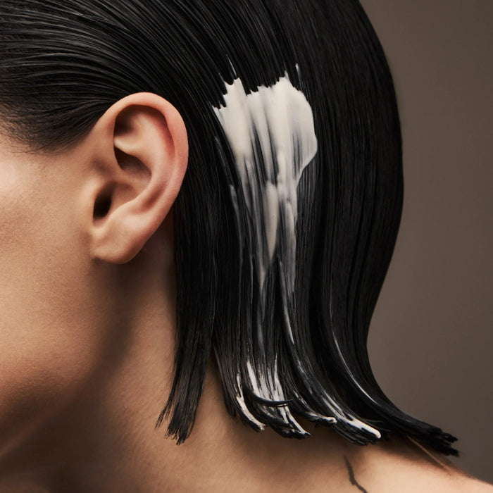 Shop Rescue Spa Gold Lust Restorative Night Creme applied to dark, damp hair for overnight repair and nourishment.