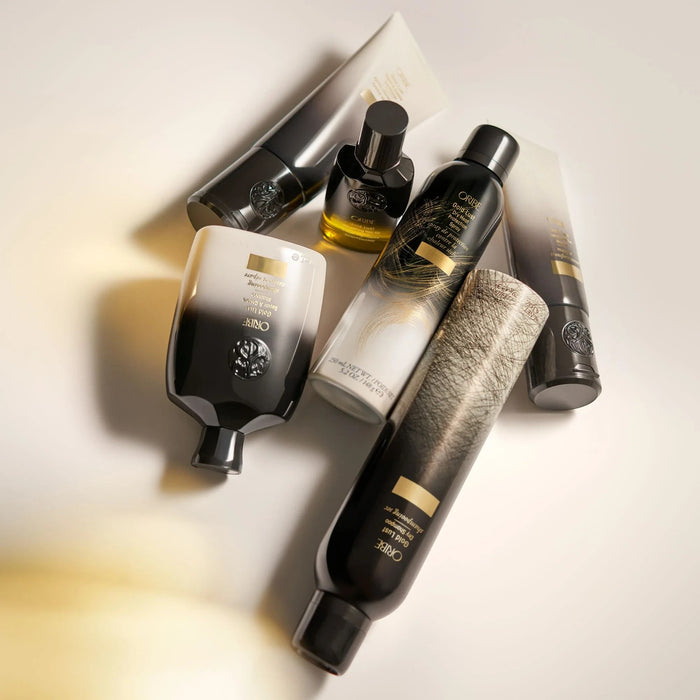 Shop Rescue Spa Oribe Gold Lust hair care collection featuring shampoo, conditioner, mask, and dry shampoo bottles.