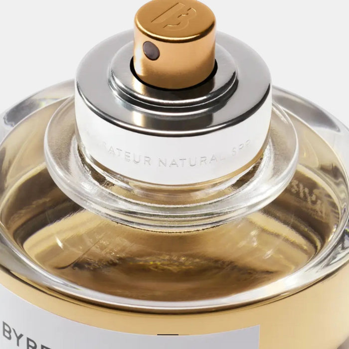 Shop Rescue Spa Gypsy Water Absolu de Parfum in a clear glass bottle with gold and silver accents. Woody, spicy, amber fragrance.