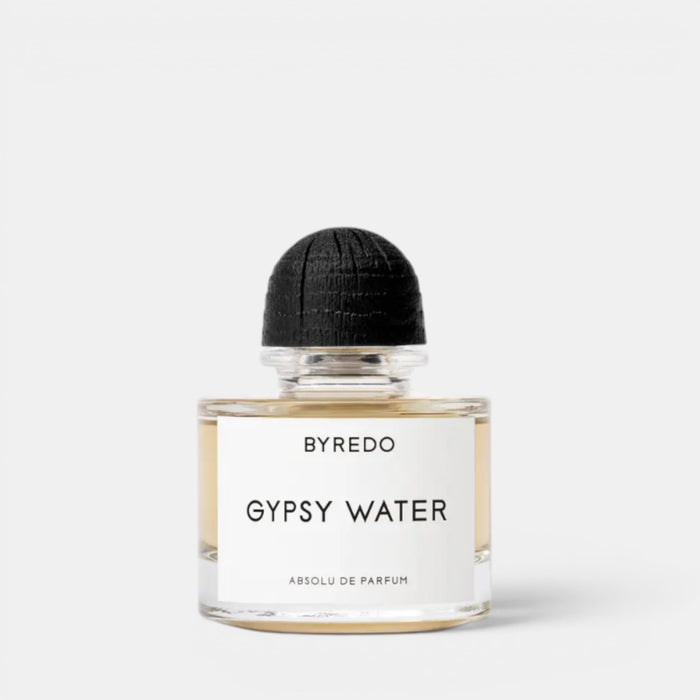 Shop Rescue Spa Byredo Gypsy Water Absolu de Parfum, a woody, spicy, amber fragrance in a clear glass bottle with a black wooden cap.