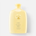 Shop Rescue Spa Oribe Hair Alchemy Resilience Shampoo in a pale yellow bottle with an embossed circular logo.