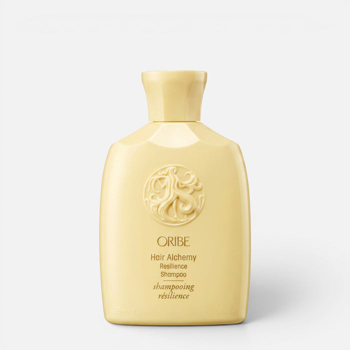 Shop Rescue Spa Oribe Hair Alchemy Resilience Shampoo in a pale yellow bottle with embossed logo detail