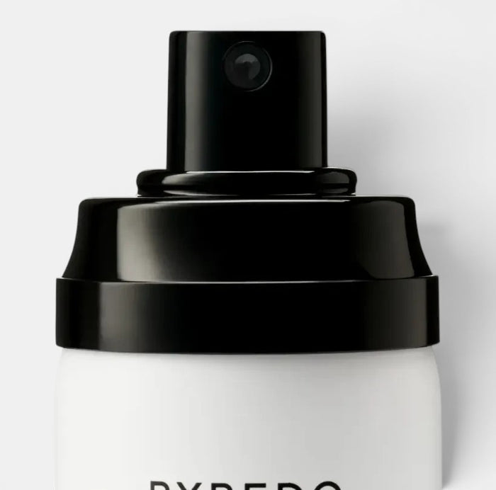 Shop Rescue Spa Hair Perfume Blanche, a white spray bottle with a black cap and nozzle. Notes of aldehyde, pink pepper, white rose, neroli, peony, violet, blonde woods, musk, and sandalwood.