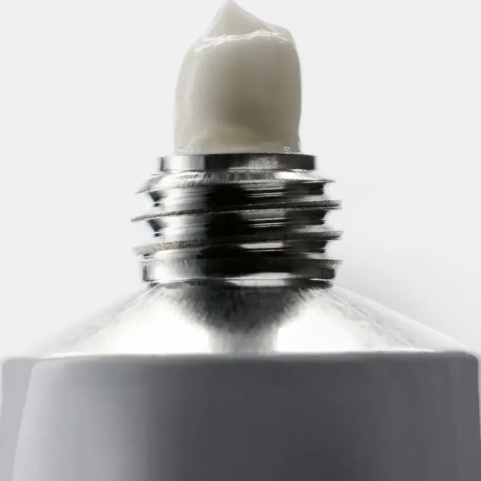 Shop Rescue Spa Hand and Nail Cream Suede, white cream in a silver metal tube, 100ml