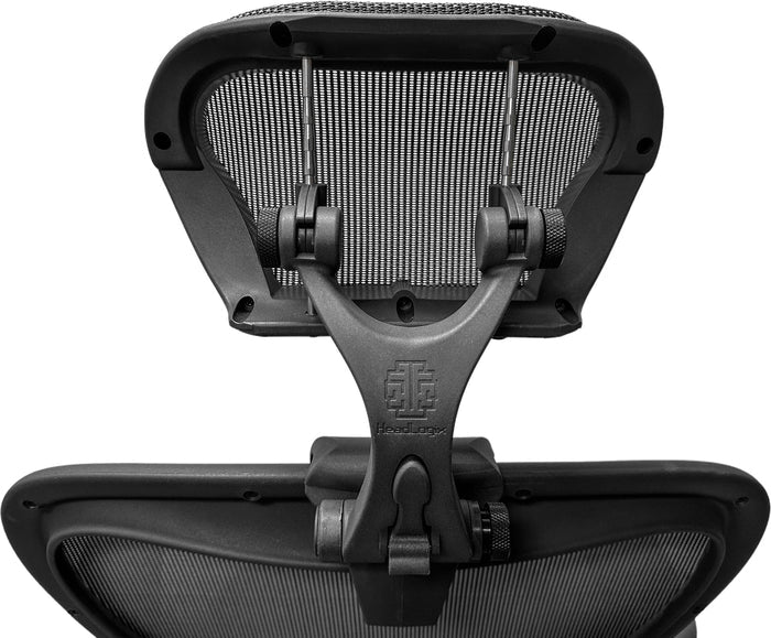 Close-up of Aeron Remastered headrest for size B and C Herman Miller chair, mesh back