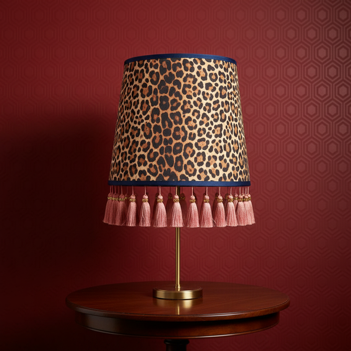 Tall animal print lampshade with smaller scale Anaglypta Hive wallpaper in Resene Rouge