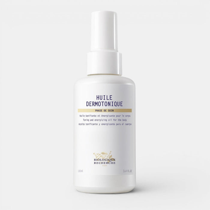 White bottle of Biologique Recherche Huile Dermotonique on a white background. Designed to tone skin, reduce cellulite, and improve firmness.