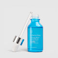 Shop Rescue Spa Dr Dennis Gross Hyaluronic Marine Hydration Booster in a blue glass bottle with a dropper