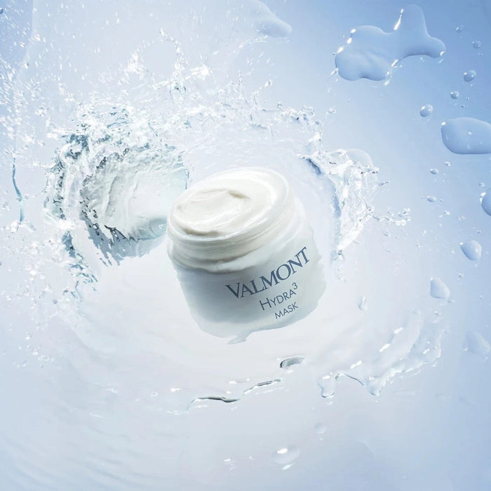 Shop Rescue Spa Valmont Hydra3 Mask in a white jar surrounded by a refreshing water splash effect.