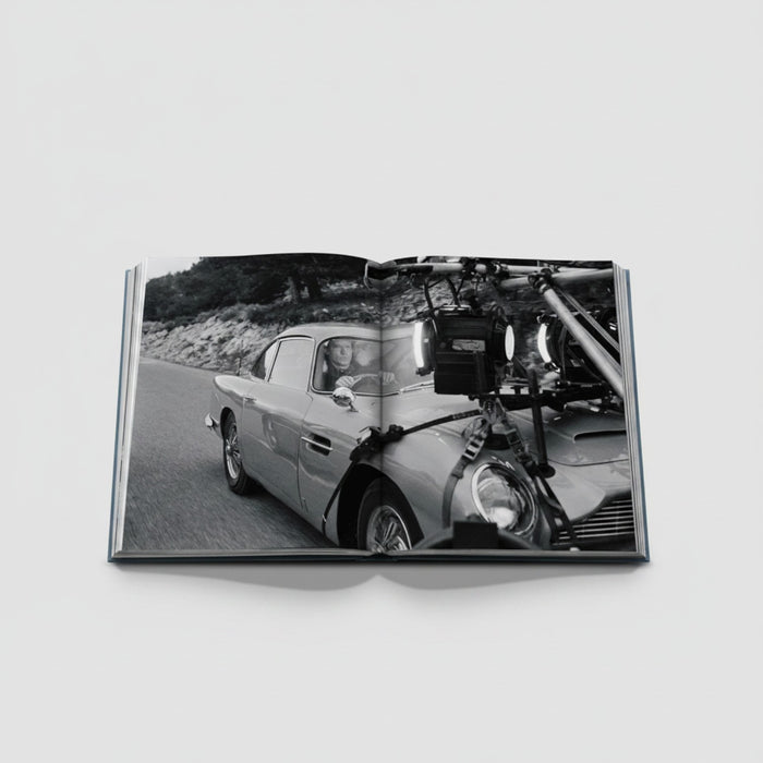 James Bond Cars book featuring an Aston Martin DB5 on set with filming equipment attached.
