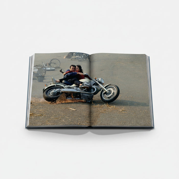 Shop Rescue Spa James Bond Cars book features a couple on a motorcycle with sparks flying. Hardcover, 312 pages.