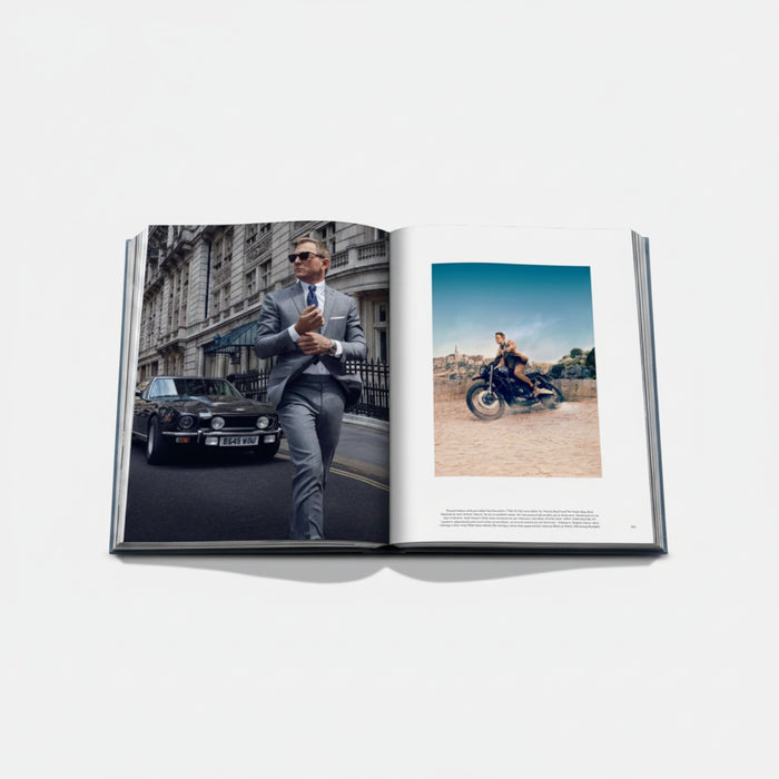 Shop Rescue Spa James Bond Cars book featuring Daniel Craig in a grey suit with an Aston Martin and a motorcycle scene.