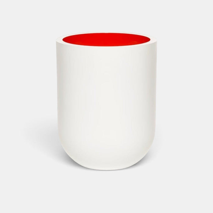 Shop Rescue Spa Jurassic Flower scented candle in a matte white porcelain vessel with a vibrant red interior.