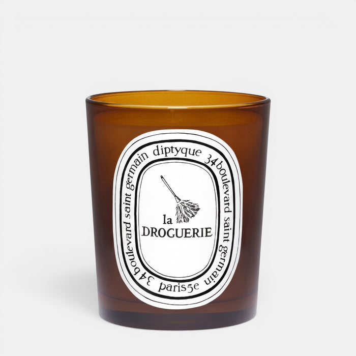 Shop Rescue Spa La Droguerie odor-removing candle in a brown glass jar with a basil, mint, and tomato leaf scent.