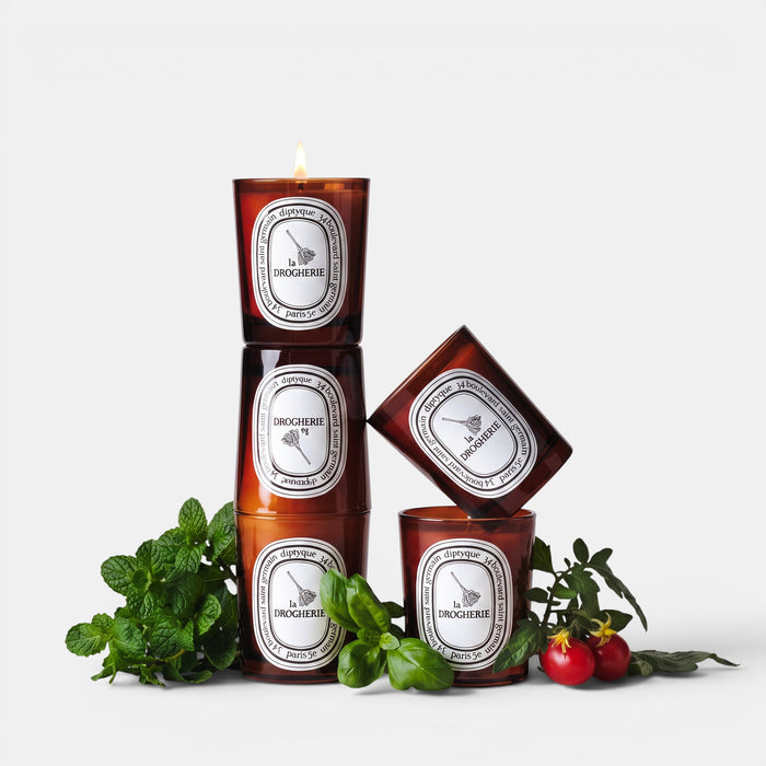 Shop Rescue Spa La Droguerie odor-removing candle in amber glass with basil, mint, and tomato leaf accents