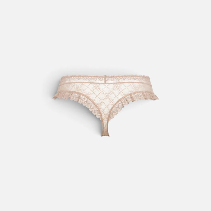 A pair of pale blush pink lace thong panties with a delicate scalloped edge and a small center bow, displayed against a light gray background.