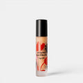 Shop Rescue Spa Susanne Kaufmann lip oil in a clear glass rollerball bottle with red floral pattern design