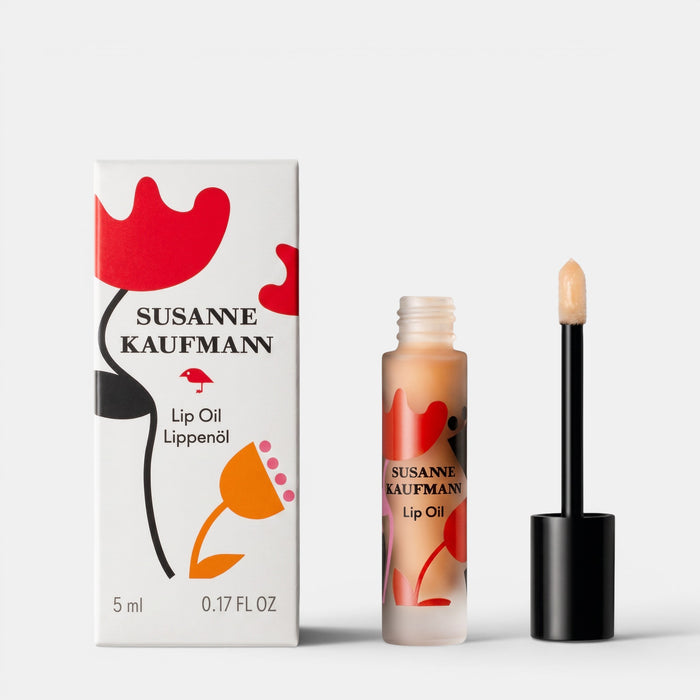 Shop Rescue Spa Susanne Kaufmann Lip Oil in a frosted glass bottle with applicator next to its floral patterned box.