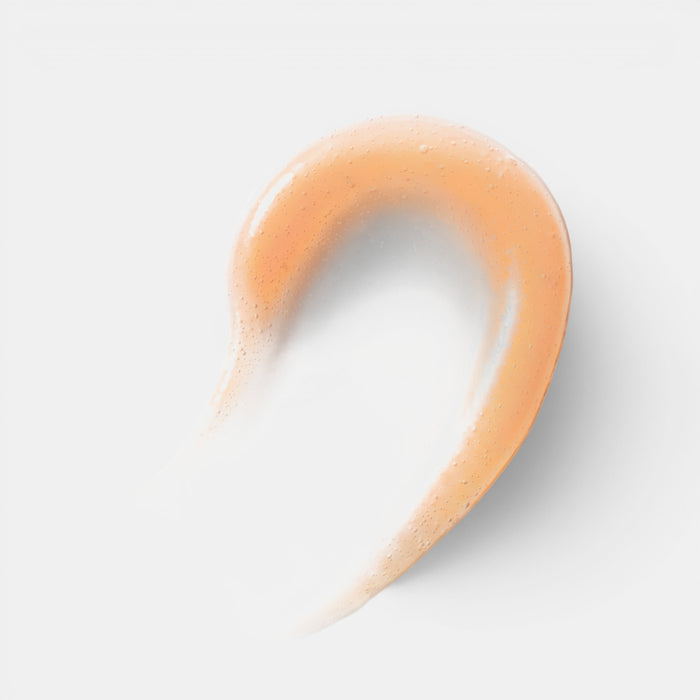 Shop Rescue Spa peach-tinted lip oil swatch with a glossy, hydrating texture on a white background.