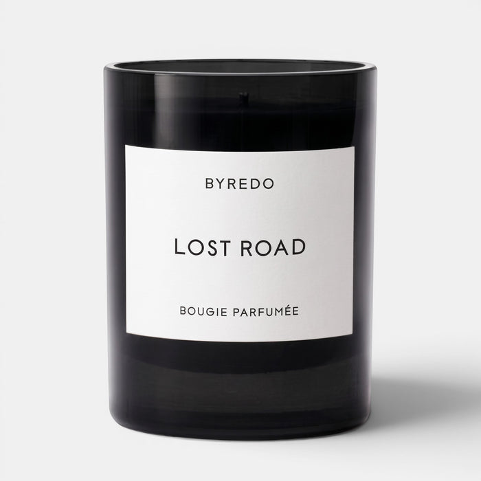 Shop Rescue Spa Lost Road scented candle in a sleek black glass jar with a minimalist white label