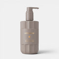 Shop Rescue Spa Love Delight body lotion in a taupe fluted bottle with a pump dispenser and gold lettering.