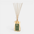 Antica Magnolia Bloom reed diffuser with wooden sticks in a glass bottle on a white background