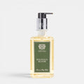 Shop Rescue Spa Magnolia Bloom hand and body wash in a clear rectangular bottle with a black pump dispenser.