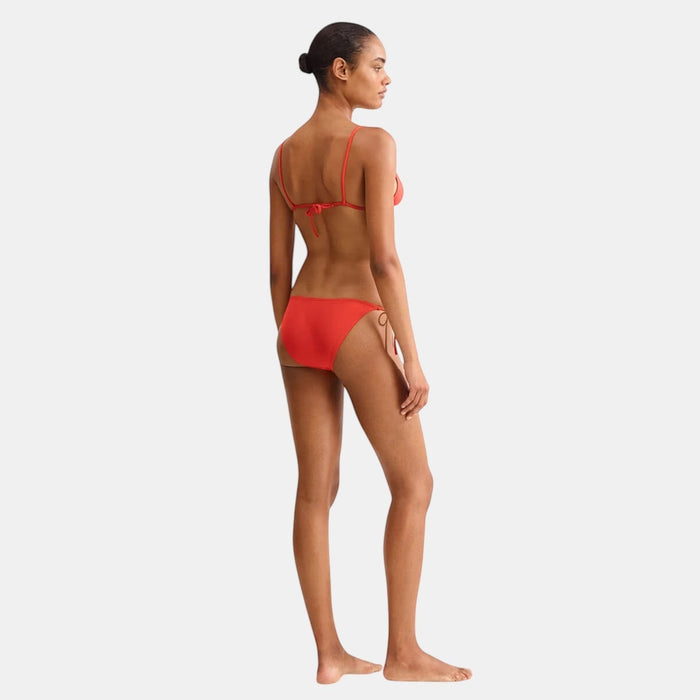 Shop Rescue Spa Malou bikini briefs in red with side ties. Model is wearing a size larger than normal.