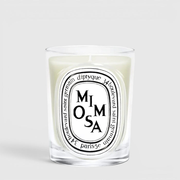 Shop Rescue Spa Diptyque Mimosa scented candle in a clear glass vessel with a signature oval label