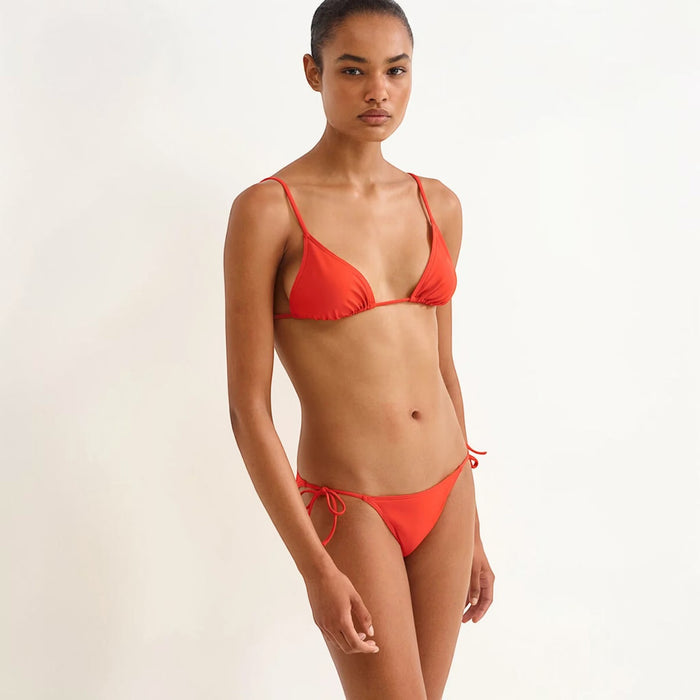 Shop Rescue Spa Mouna Rooibos sliding small triangle bikini top in red with spaghetti straps and tie sides.