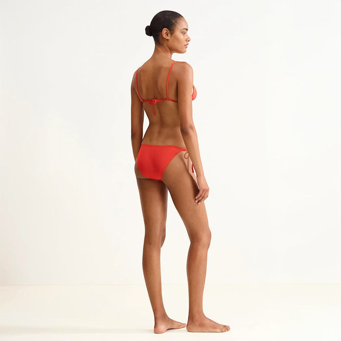 Shop Rescue Spa Mouna Rooibos sliding small triangle bikini top in red with spaghetti straps and adjustable side ties.