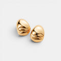 Shop Rescue Spa Nelle Hoop Earrings in high-polish 14k gold dipped brass with organic rippled texture.