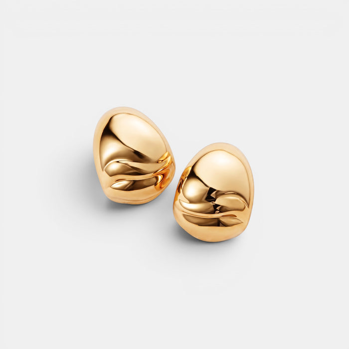 Shop Rescue Spa Nelle Hoop Earrings in high-polish 14k gold dipped brass with organic rippled texture.