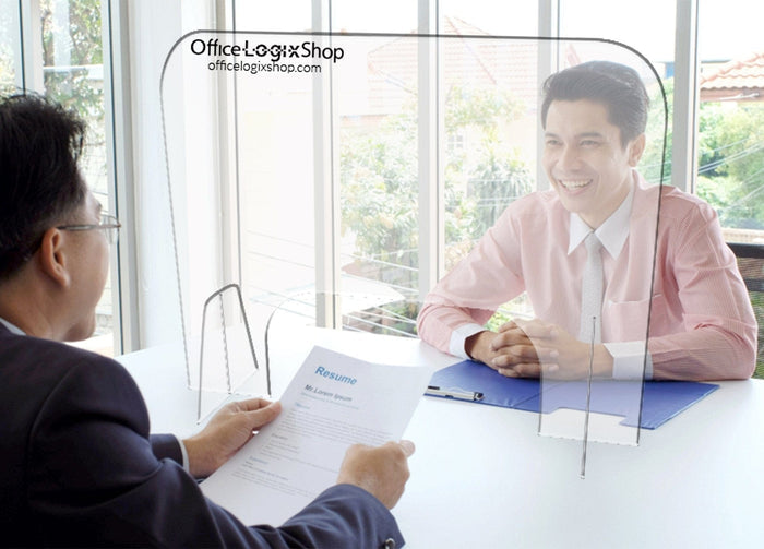 Office Logix Shop plexiglass desk divider in use during a professional office meeting