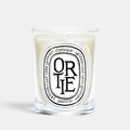 Shop Rescue Spa Ortie scented candle in a clear glass vessel with a signature oval label featuring green wax.