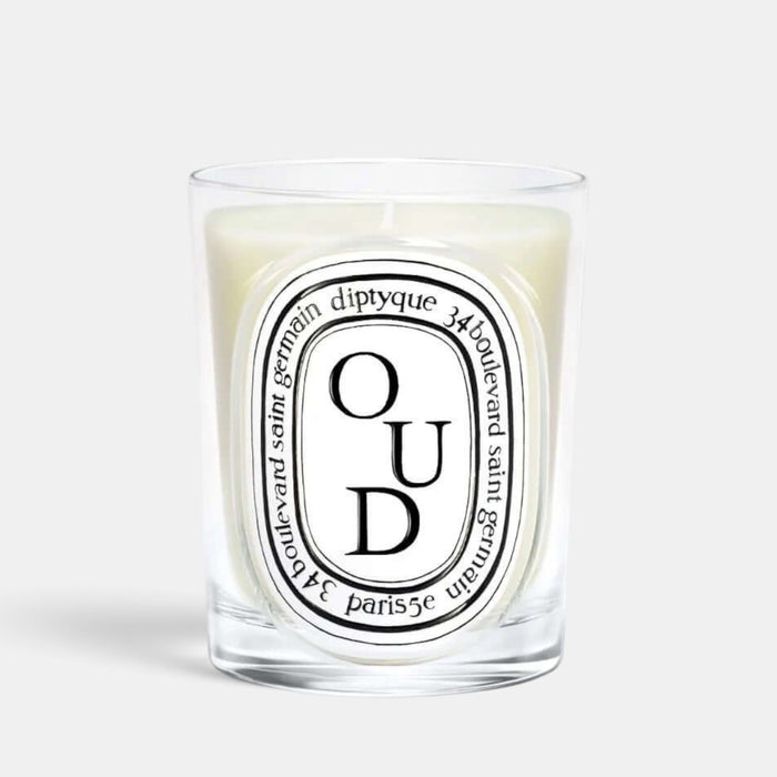 Shop Rescue Spa Oud scented candle in a clear glass vessel with a signature oval label
