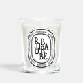 Shop Rescue Spa Diptyque Rhubarbe scented candle in a clear glass vessel with a signature oval label