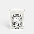 Shop Rescue Spa Roses scented candle in a clear glass jar with a white wax finish and signature oval label