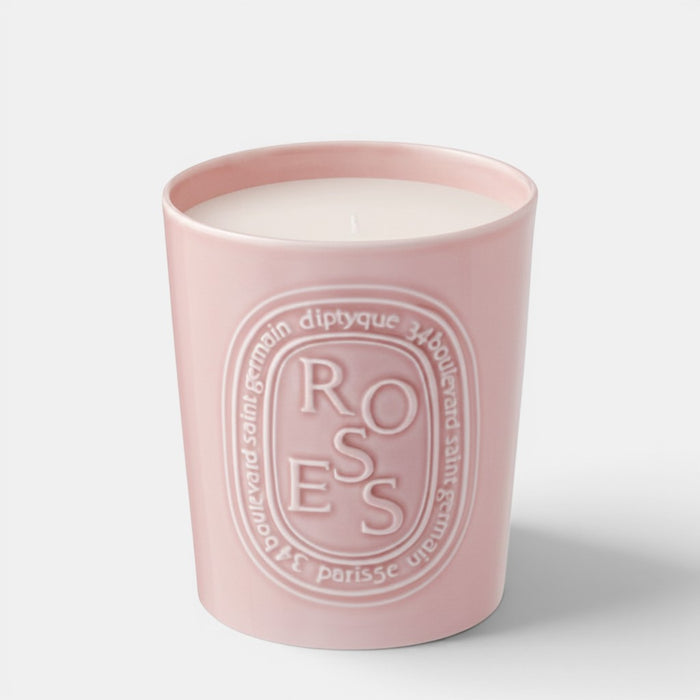 Shop Rescue Spa Roses scented candle in a light pink ceramic vessel with embossed floral branding