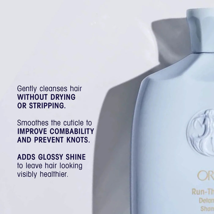 Shop Rescue Spa Oribe Run-Through Detangling Shampoo bottle, light blue, for all hair types, adds shine and moisture.