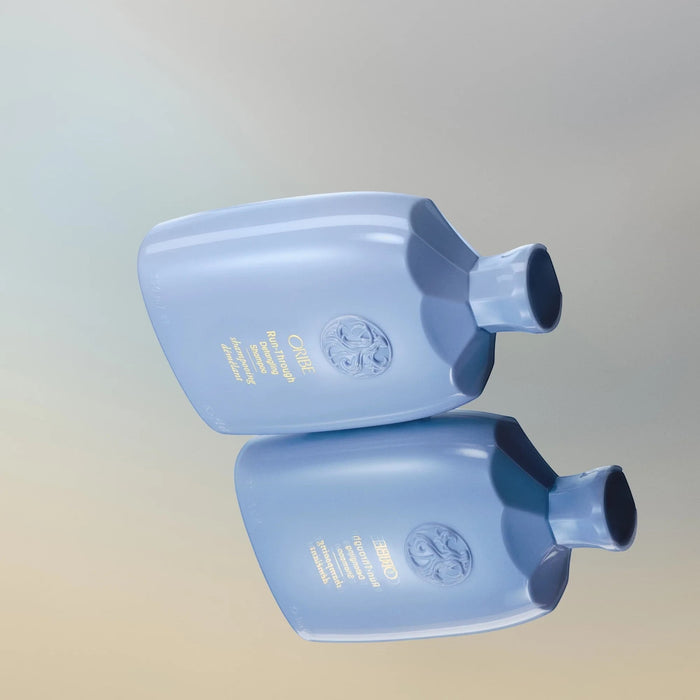 Shop Rescue Spa Oribe Run-Through Detangling Shampoo bottle in light blue with gold lettering. For all hair types.