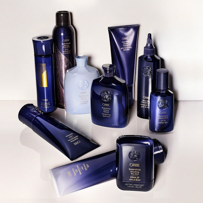 Shop Rescue Spa Oribe Run-Through Detangling Shampoo for all hair types, in a blue bottle.