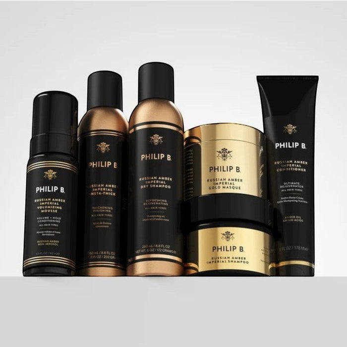 Shop Rescue Spa Philip B Russian Amber hair care collection featuring gold and black bottles and jars