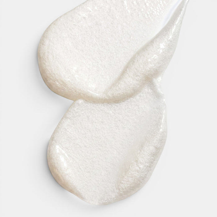 Shop Rescue Spa Scalp Booster leave-in serum with a pearlescent white, smooth gel-like texture on a white background.