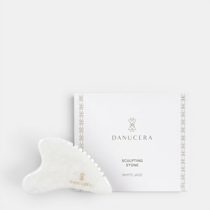 Shop Rescue Spa DANUCERA Sculpting Stone made of white jade for facial massage, shown with its branded white box.