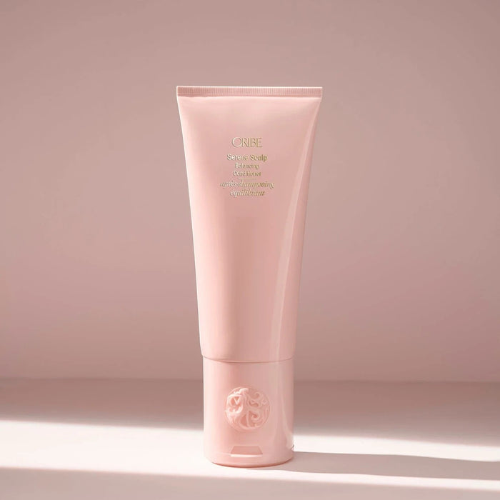Shop Rescue Spa ORIBE Serene Scalp Balancing Conditioner in a pale pink tube, hydrating and soothing for hair and scalp.